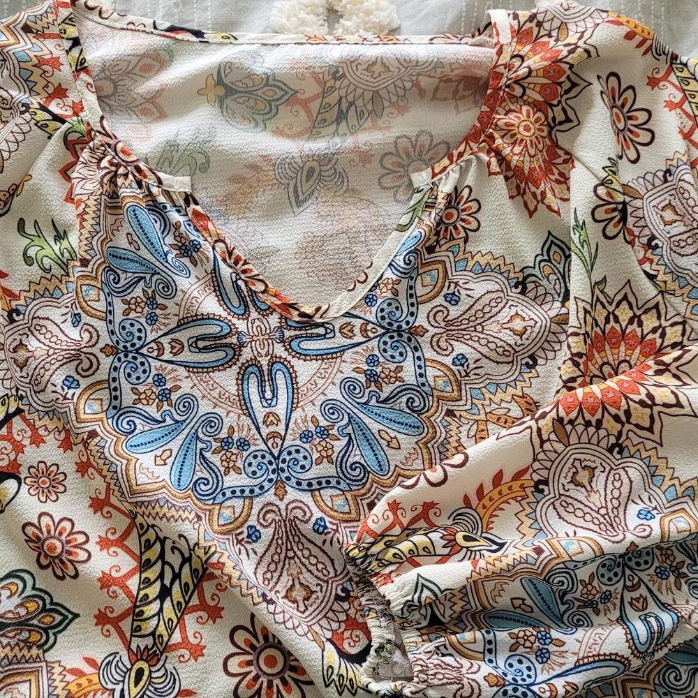 Polyester tunic, great with jeans or dress pants, very colorful, super comfy